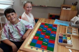Montessori students working with the Montessori Checkerboard material during the first week of school. Into the trillions!