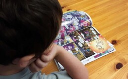 Lyonsgate Montessori Elementary student developing reading skills with a graphic novel.