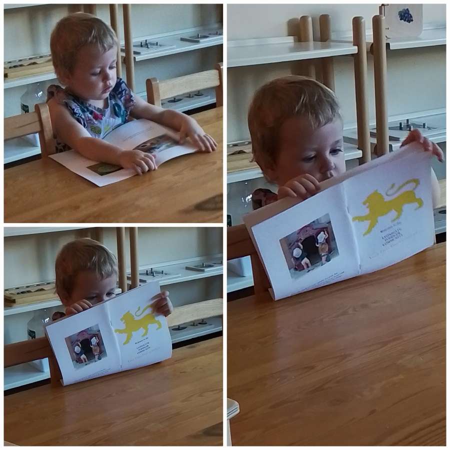 Montessori student during the first day back to school, September 2023. Reading the Introduction to Toddler booklet.