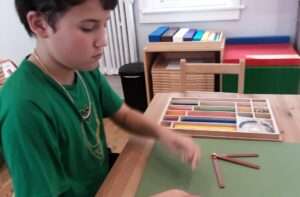 Lyonsgate Montessori Elementary student working with the Geometry Box of Sticks material.