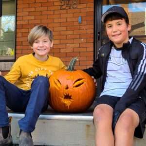 Lyonsgate Montessori elementary students with their carved pumpkin.