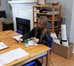 Lyonsgate Montessori Elementary student preparing a weekly work plan.