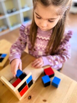 Lyonsgate Montessori Casa student woriking with the Binomial Cube material.