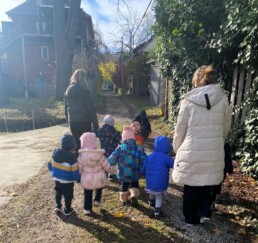 Lyonsgate Montessori Toddler students out for a sunny fall walk.
