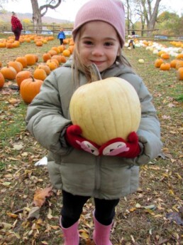 Lyonsgate Montessori student on a pumpkin patch field trip.