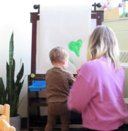 Lyonsgate Montessori Toddler student painting en Francais.