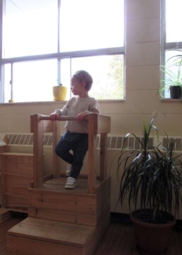Lyonsgate Montessori Toddler student observing the classroom.