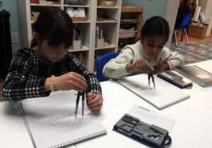 Lyonsgate Montessori Elementary students working with compasses.