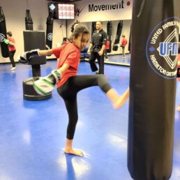 Lyonsgate Montessori Elementary student learning kickboxing during martial arts phys. ed.