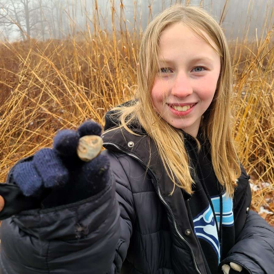 Lyonsgate Montessori Elementary student with a fossil find on a class hike.