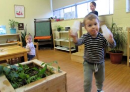 Lyonsgate Montessori Toddler students putting on a musical parade.