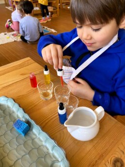 Lyonsgate Montessori Casa student learning about mixing colours.