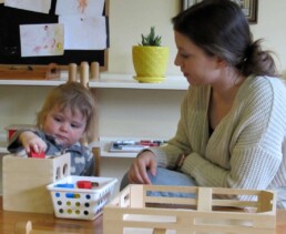 Lyonsgate Montessori Toddler student developing motor skills and being introduced to geometry.