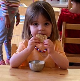 Lyonsgate Montessori Casa student enjoying a pancake on Shrove Tuesday.