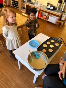 Lyonsgate Montessori Casa students waiting for pancakes on Shrove Tuesday.