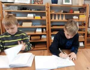 Lyonsgate Montessori Elementary students writing in their journals.