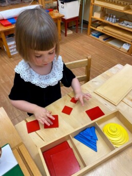 Lyonsgate Montessori Casa student working with the Graded Shapes material.