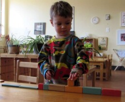 Lyonsgate Montessori Toddler student working with magnetic blocks.