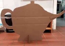 Lyonsgate Montessori Elementary students made a giant cardboard teapot prop.