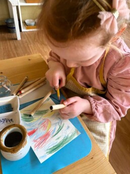 Lyonsgate Montessori Casa student working with watercolour pencils.