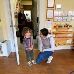 Lyonsgate Montessori Toddler student visiting his new classroom and teacher in preparation for September, when he will be a Lyonsgate Montessori Casa student.
