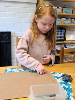 Lyonsgate Montessori School Elementary student developing fine motor skills through art and imagination.