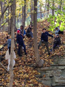 Lyonsgate Montessori School Elementary students exploring the rocks of the escarpment.