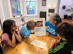 Lyonsgate Montessori School Elementary students being introduced to a French play as part of their French language education program.