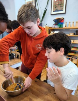 Lyonsgate Montessori School Elementary students making pumpkin bread.