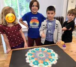 Lyonsgate Montessori School Elementary students with their rangoli design for Diwali.