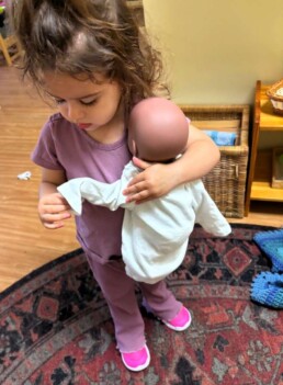 Lyonsgate Montessori School Toddler student dressing the class 
