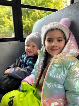 Lyonsgate Montessori School Casa students on the bus on their way to a Halloween field trip.
