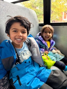 Lyonsgate Montessori School Casa students on the bus on their way to a Halloween field trip.