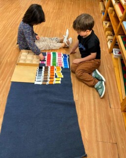 Lyonsgate Montessori School Casa students working with the Montessori Colour Box 3 material.