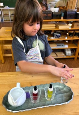 Lyonsgate Montessori School Casa student learning about mixing primary colours.