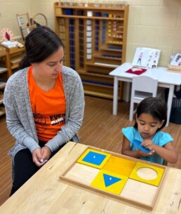 Lyonsgate Montessori School Casa student receiving a presentation with the Montessori Geometry Cabinet material.