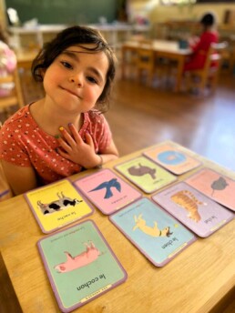 Lyonsgate Montessori School Casa student learning the French vocabulary for different animals.
