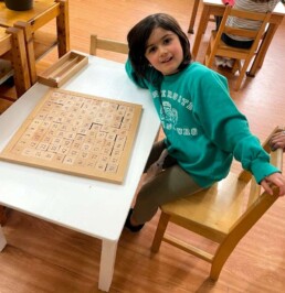 This Lyonsgate Montessori School Casa student has completed the big task of counting from 1-100.