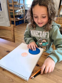 Lyonsgate Montessori School Elementary student creating a 