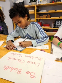 Lyonsgate Montessori School Elementary student practicing writing by recreating the Blue Jays batting order.