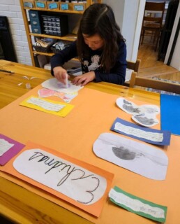 Lyonsgate Montessori School Elementary student working on her echidnas poster project.