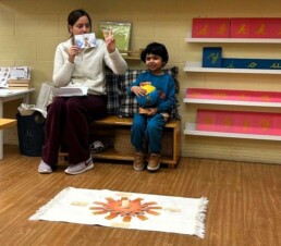 Lyonsgate Montessori School Casa student celebrating his birthday with the class by showing photos of each year of his life so far, and by taking