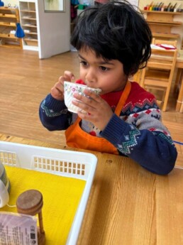 Lyonsgate Montessori School Casa student enjoying the fruits of his labour with the Montessori Making Tea activity.