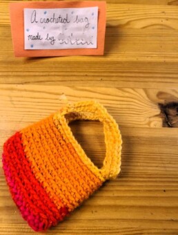 A Lyonsgate Montessori School Elementary student made a crochet bag for their charity outreach project fundraising sale.