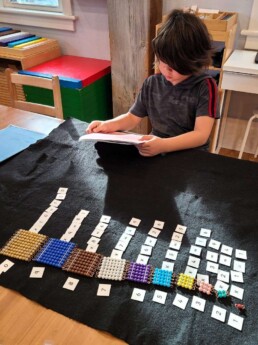 Lyonsgate Montessori School Elementary student learning about squares of numbers.