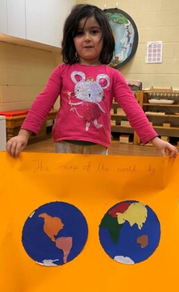 Lyonsgate Montessori School Casa student with her map of the world that she made -- a popular project in Casa right now.