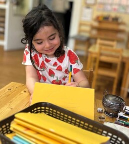 A Lyonsgate Montessori School Casa student sketching.