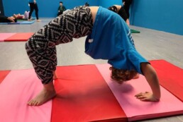 Lyonsgate Montessori School Elementary student in a bridge during winter phys. ed. dance class at Elev8 Dance.