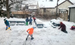 Lyonsgate Montessori School Elementary students building forts after the snowstorm.