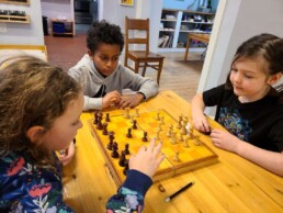 Lyonsgate Montessori School Elementary students participating in their chess club.